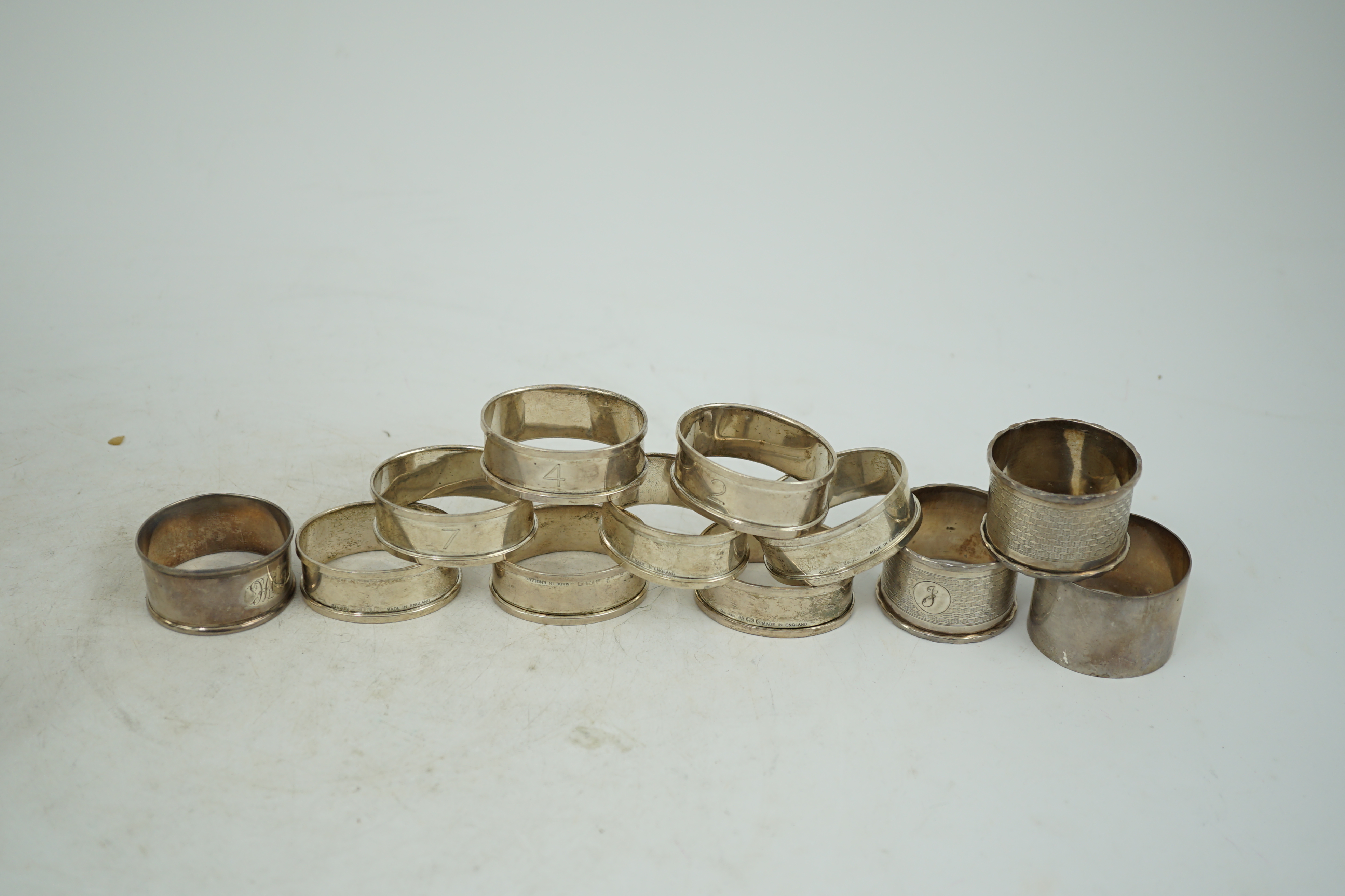 A matched set of eight early 1930's silver napkin rings and four other silver napkin rings including a pair, Birmingham, 1929, 5.3oz.